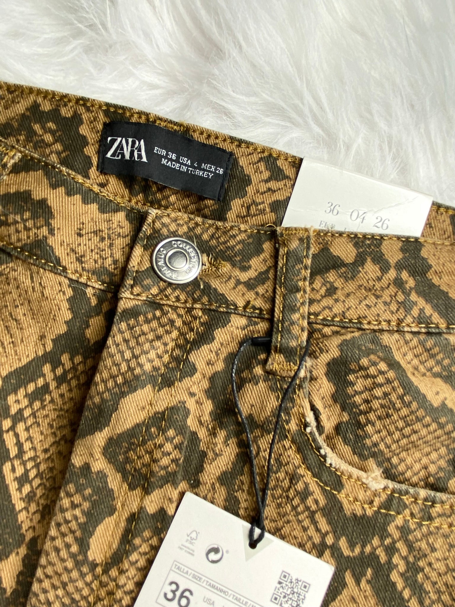 zara snake print jeans, size 4 shown on a 26” waist